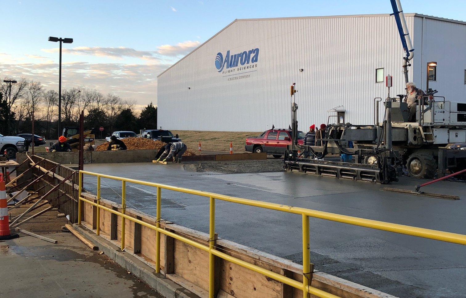 T&M crew pouring and finishing a concrete slab at the Aurora Flight Sciences facility in Columbus, Mississippi